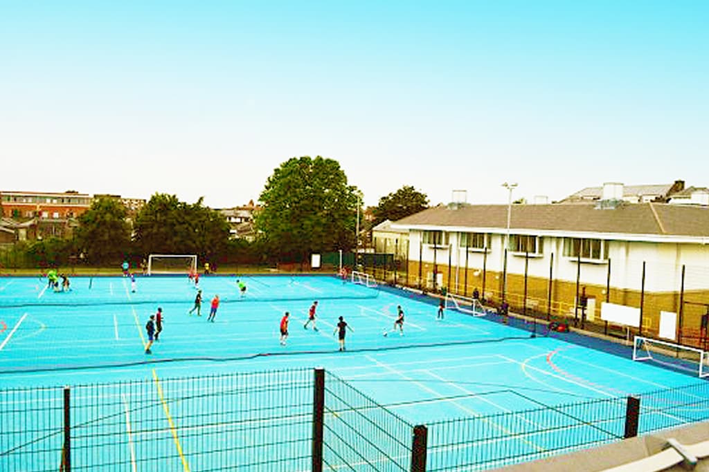 Outdoor blue sports courts at La Retraite School